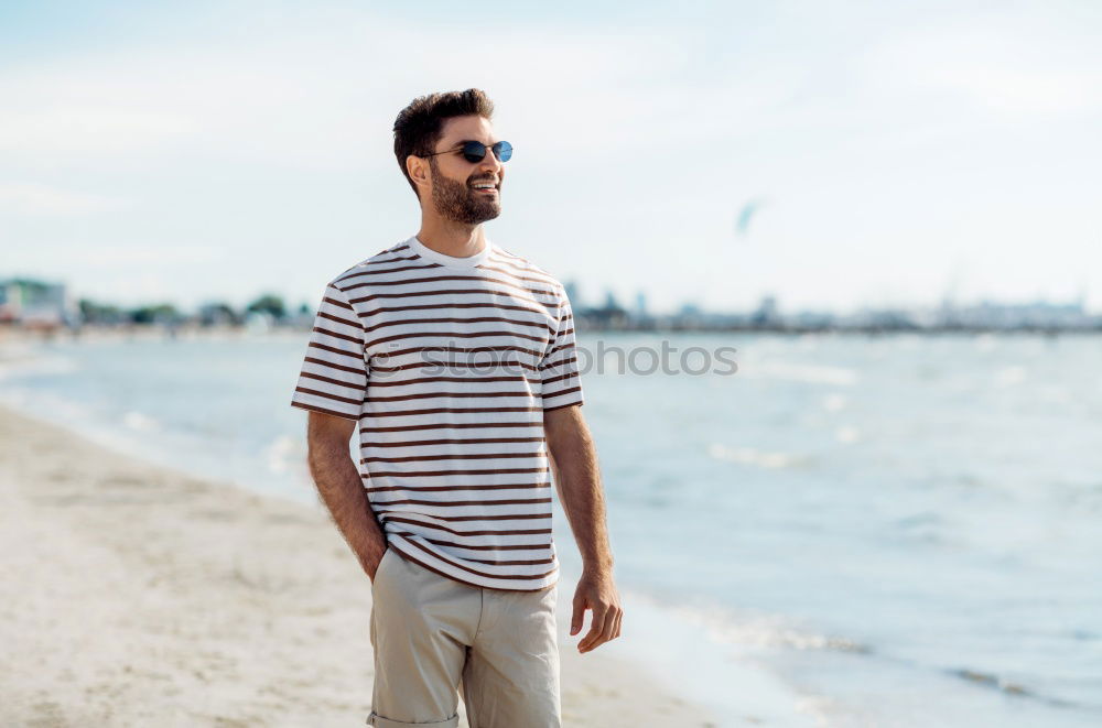 Similar – Man with skateboard at beach