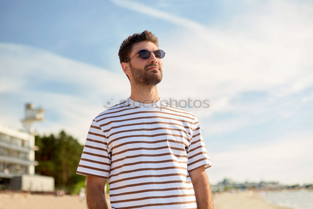 Similar – Man with skateboard at beach