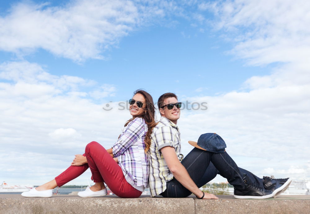 Beautiful women seating in the street.