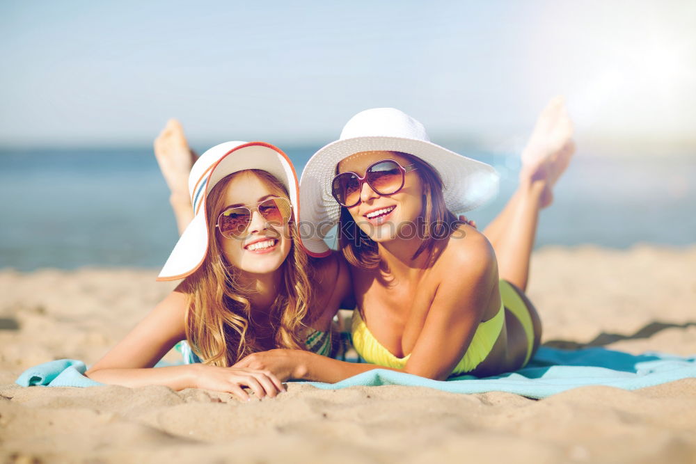 Similar – Image, Stock Photo Two women on the sand of a tropical beach