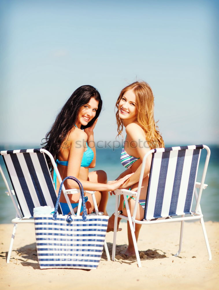 Similar – Two young women in swimsuit on a tropical beach