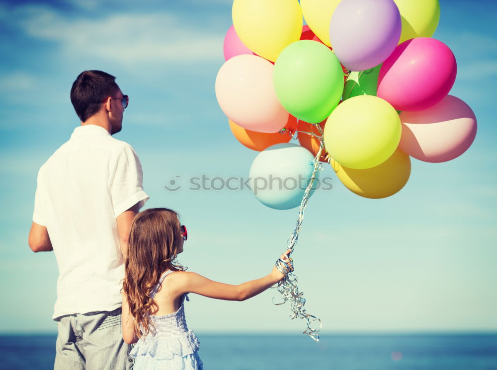 Similar – Image, Stock Photo Father and son playing with balloons in the park