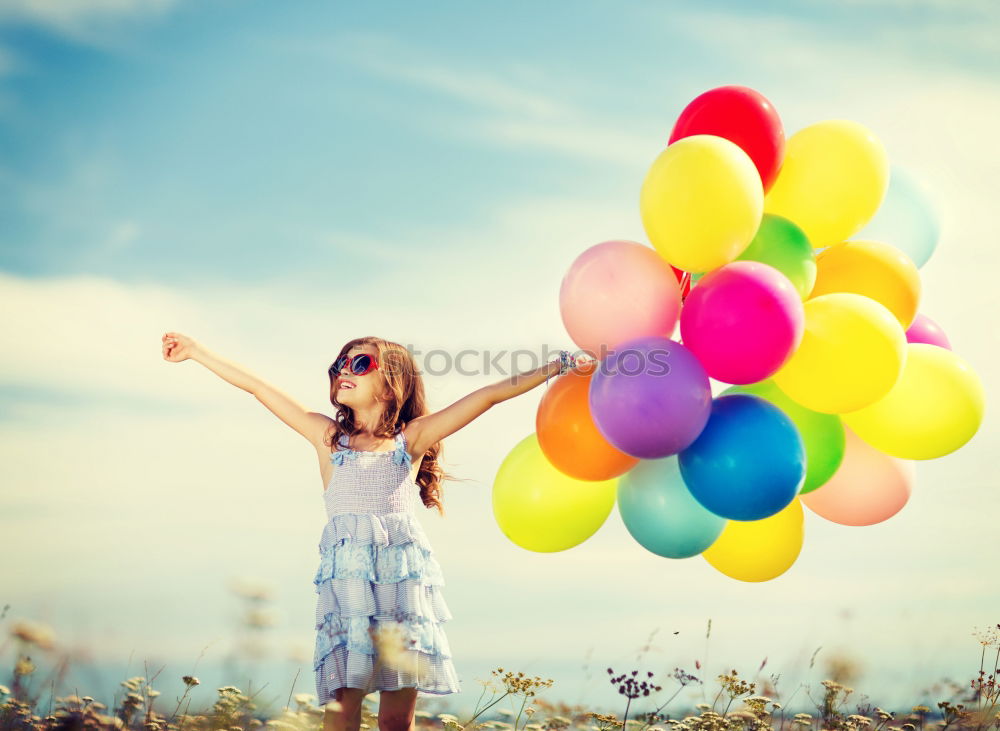 Similar – young woman with balloon on the mountain at a city