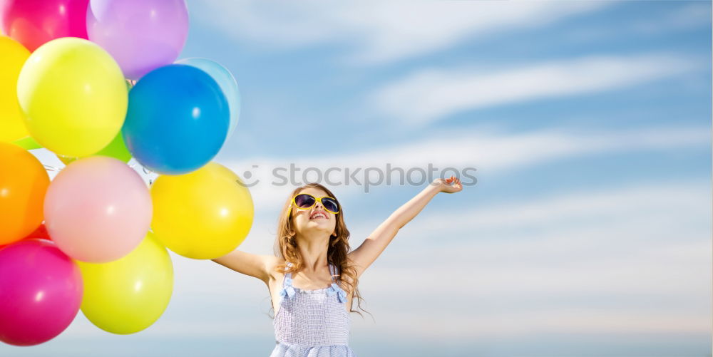 Similar – Father and daughter with balloons playing on the beach