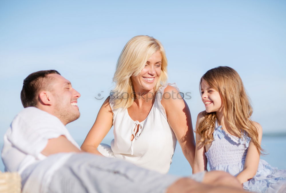 Similar – Father and children playing on the beach at the day time. Concept of friendly family.