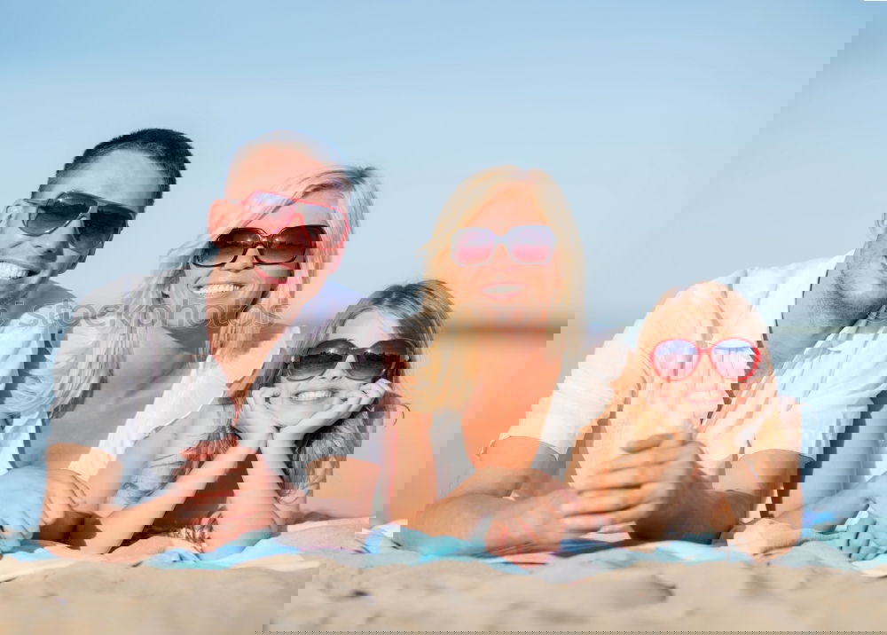 Image, Stock Photo Father and children sitting on the beach at the day time. Concept of happy friendly family.