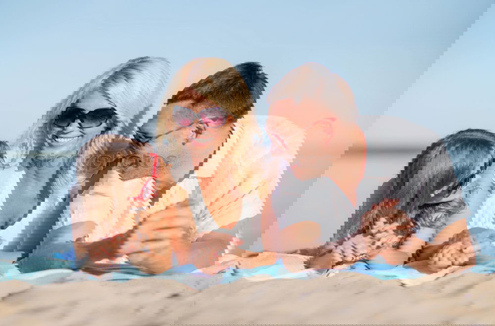 Similar – Image, Stock Photo Father and children sitting on the beach at the day time. Concept of happy friendly family.