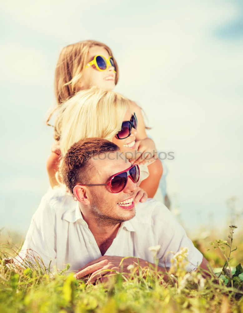 Similar – Father and son relaxing near the house at the day time. They sitting near are the colorful wall. Concept of friendly family.