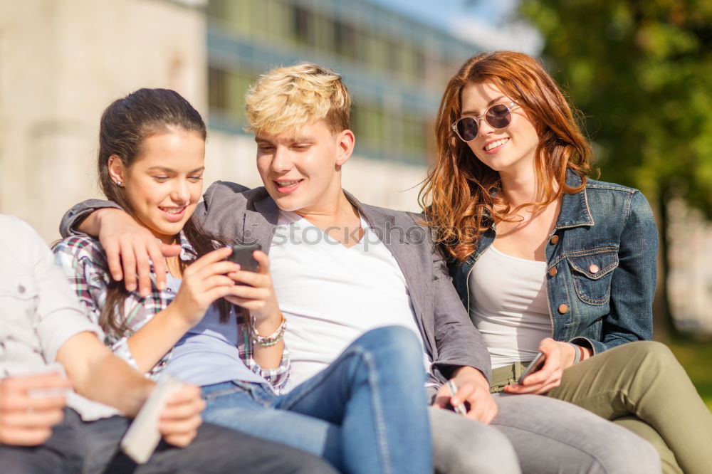 Similar – Multi-ethnic group of young people using smartphone