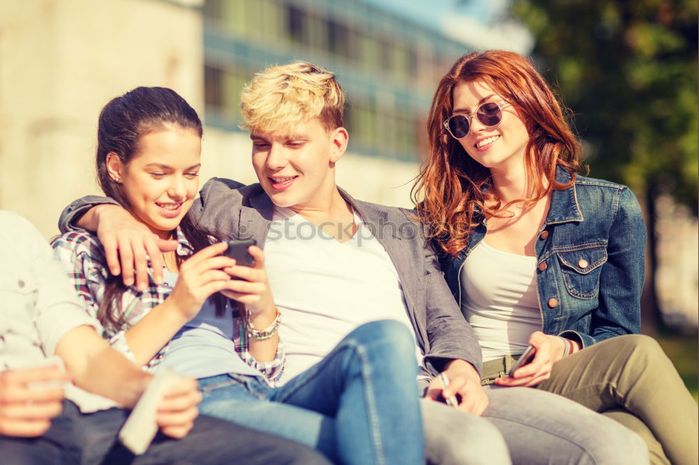 Similar – Multi-ethnic group of young people using smartphone