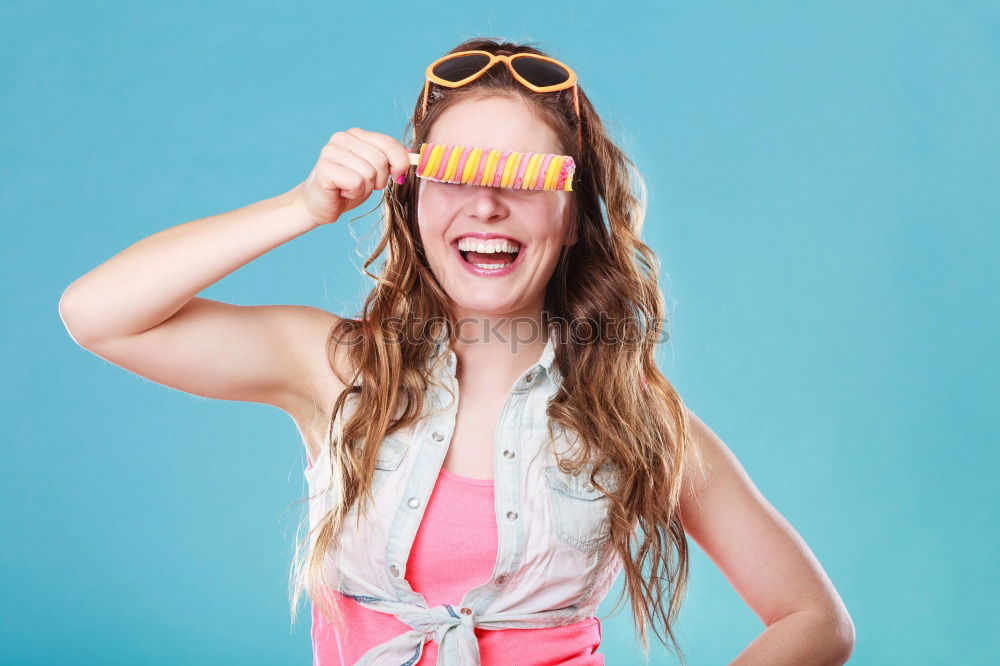 Similar – happy boy drinking orange juice on blue background