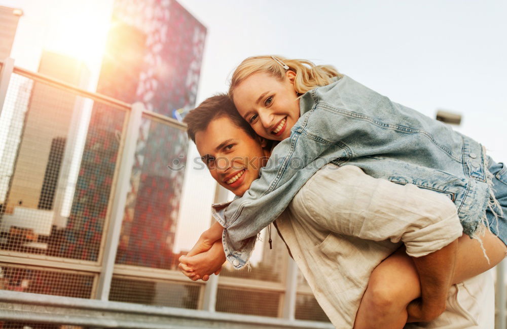 Similar – Smiling couple of lovers having fun.