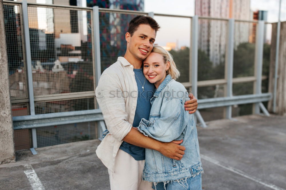 Similar – Image, Stock Photo Couple embracing on evening street