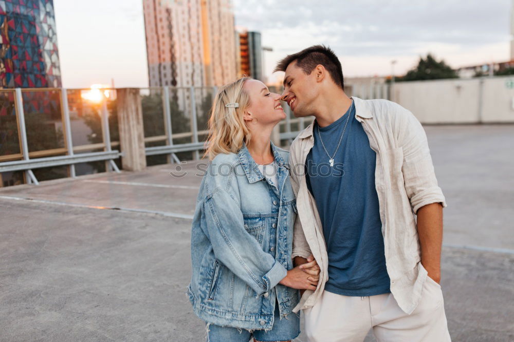 Similar – Image, Stock Photo Blonde woman and bearded man embracing and smiling together with a van in the background at sunset.