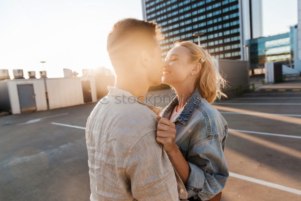 Similar – Image, Stock Photo Blonde woman and bearded man embracing and smiling together with a van in the background at sunset.