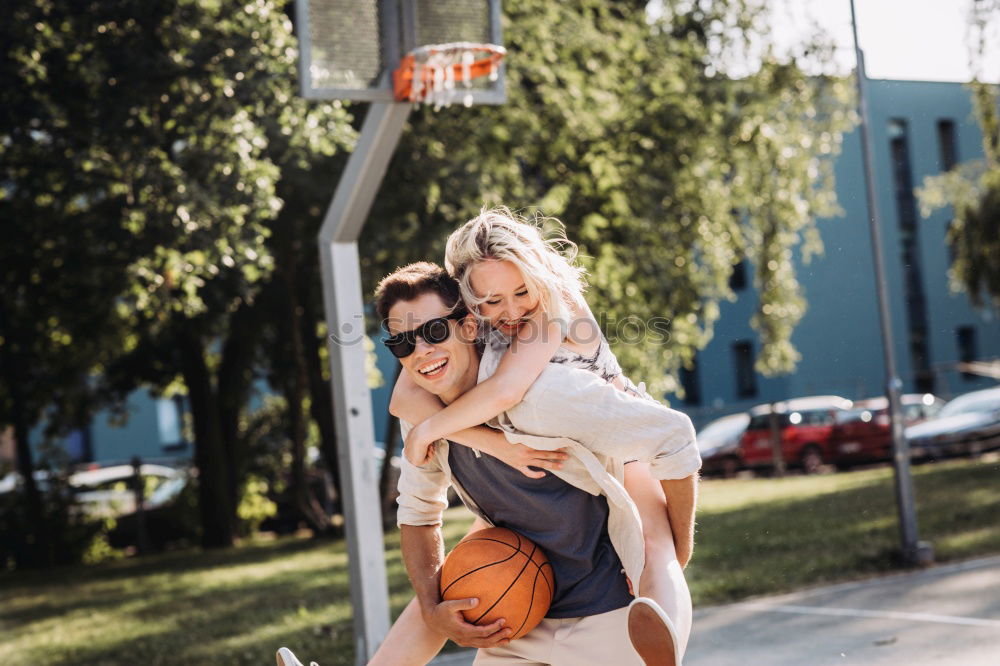 Image, Stock Photo Happy couple hugging and kissing near tree in park