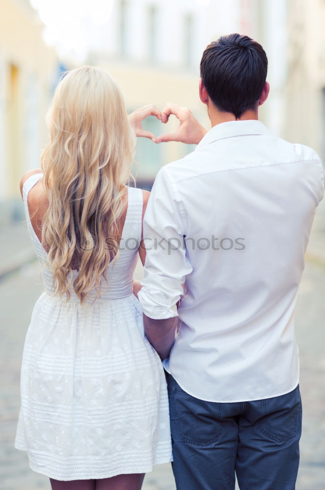 Similar – Romantic Young Couple Walking in the City.