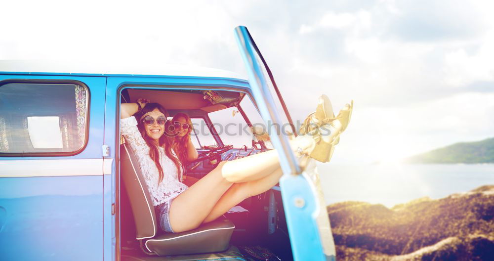 Similar – Unrecognizable man resting feet up sitting on the car