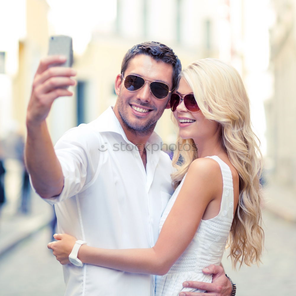 Similar – young cheerful couple taking a selfie