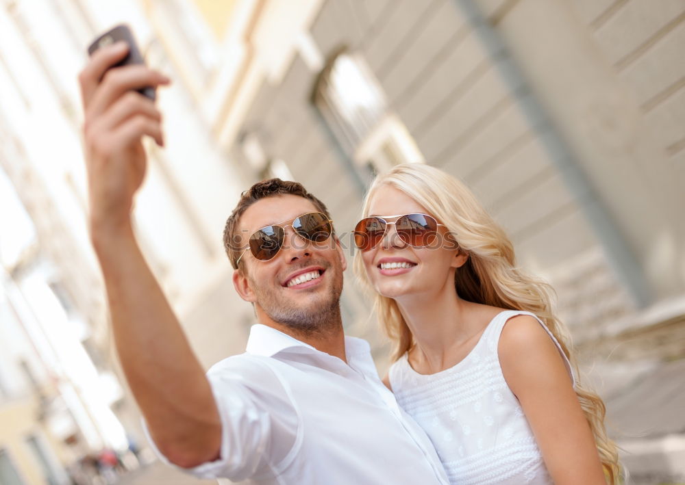 Similar – young cheerful couple taking a selfie