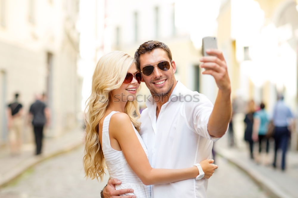 Similar – Image, Stock Photo Romantic Young Couple taking a photo with mobile phone.