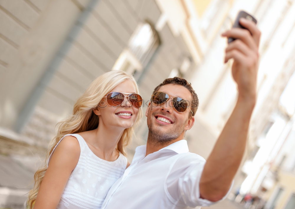 Similar – young cheerful couple taking a selfie