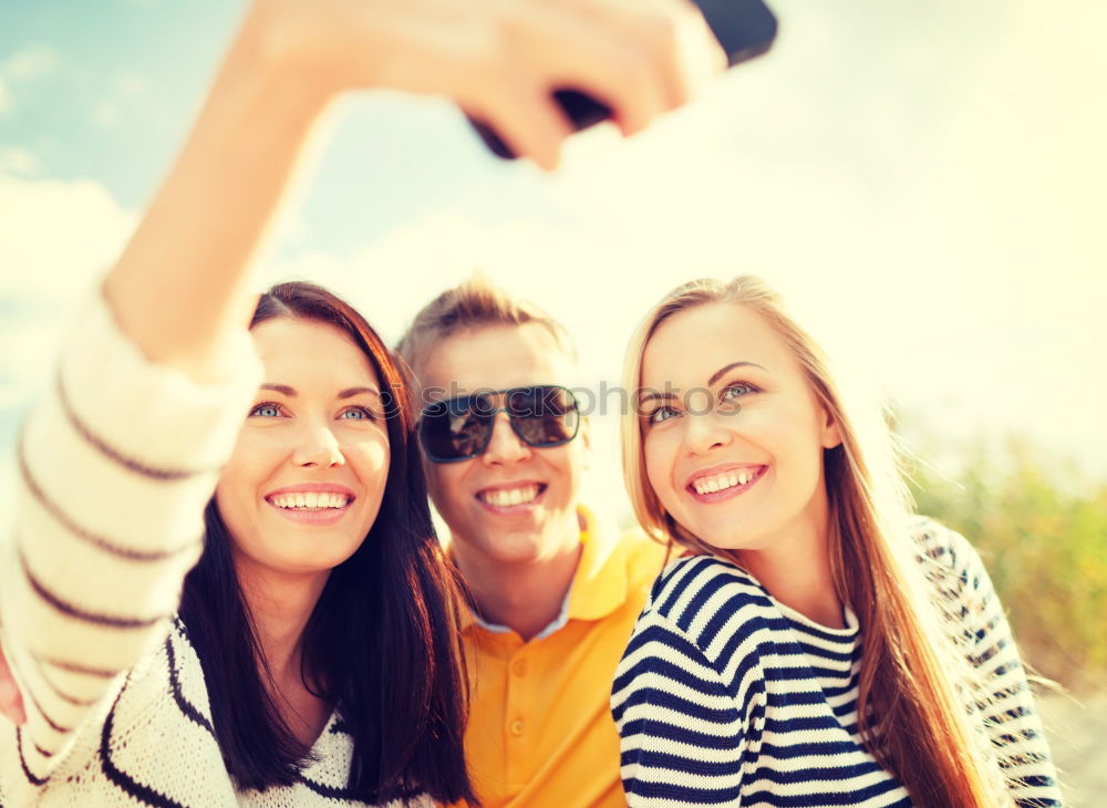 Similar – Beautiful women taking a selfie portrait in the park.