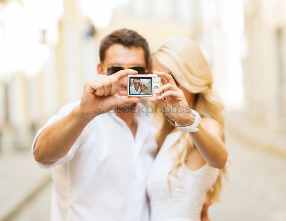 Similar – young cheerful couple taking a selfie