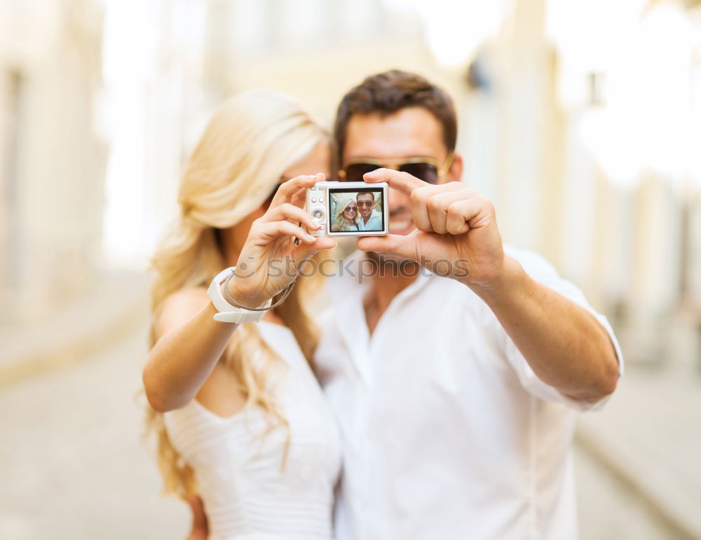 Similar – young cheerful couple taking a selfie