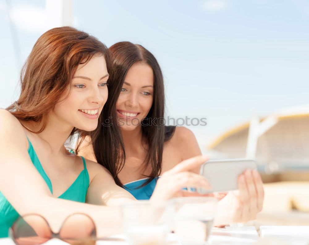 Similar – Image, Stock Photo Two male teenagers surfing the internet on tablet computer while sitting in cafe. One young man pointing at screen