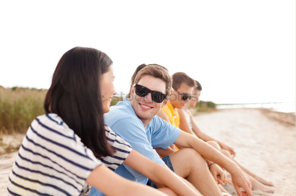 Similar – Family spending vacation time together having a snack sitting on jetty over the lake on sunny day in the summertime