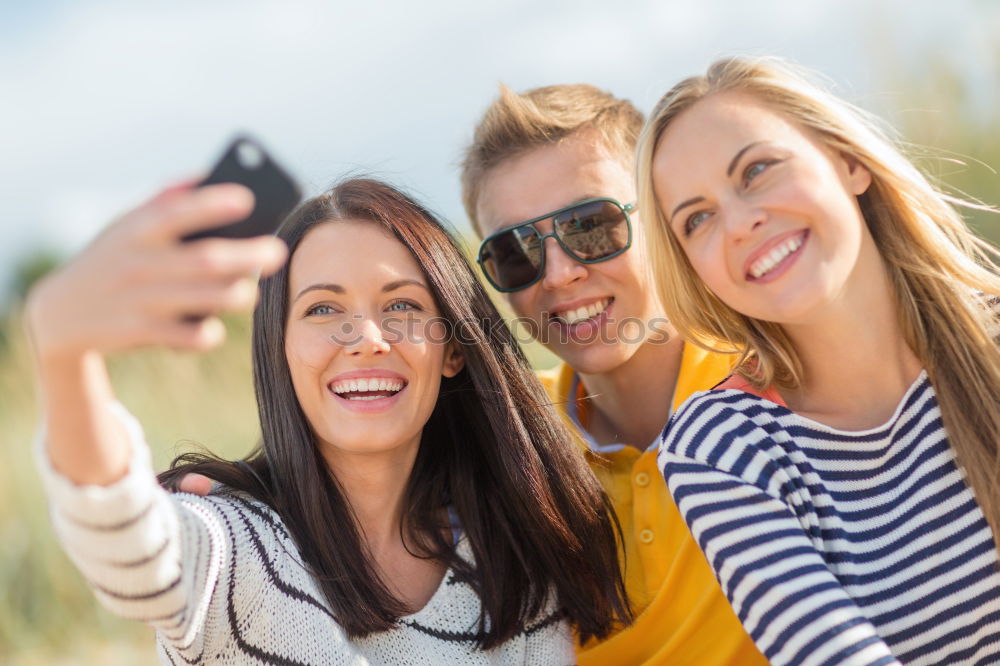 Similar – Beautiful women taking a selfie portrait in the park.