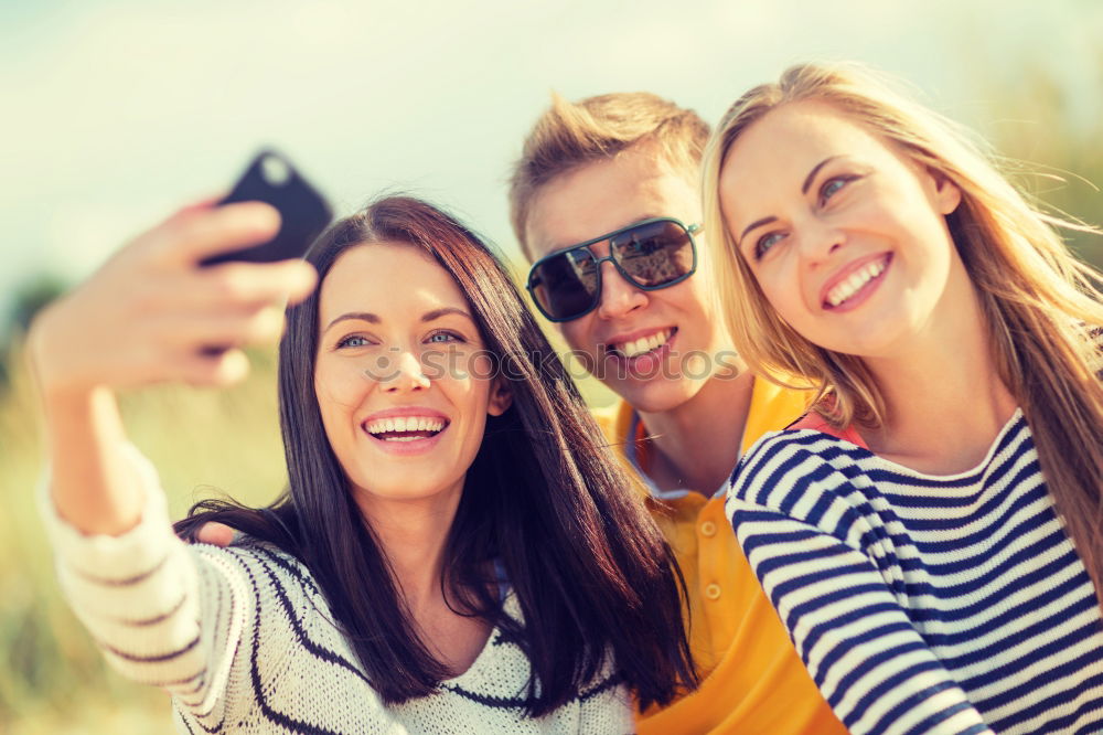 Similar – Beautiful women taking a selfie portrait in the park.