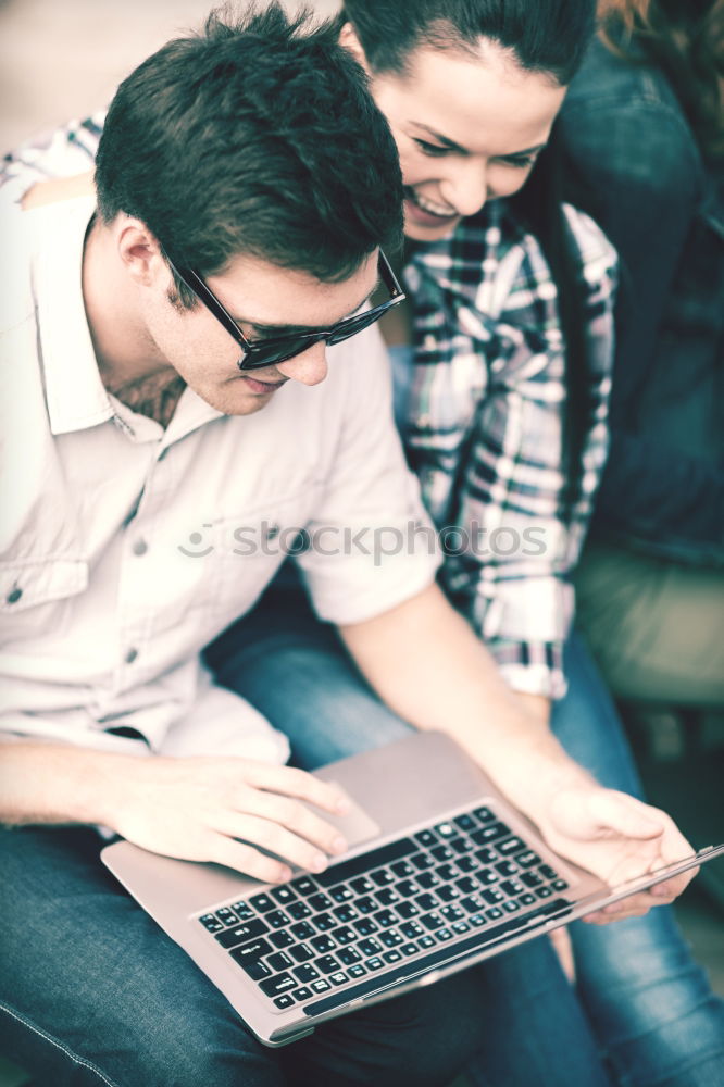 Similar – Image, Stock Photo Two teenagers in white sports shirts using tablet PC in cafeteria. They looking at pad screen