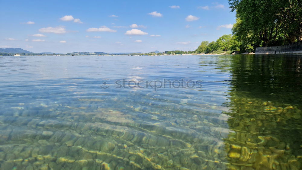 Similar – Image, Stock Photo Park bench with trees on the lake shore