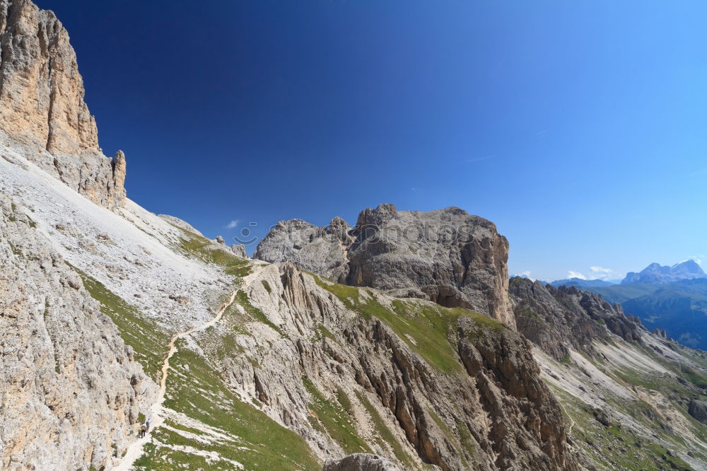 Similar – Image, Stock Photo Clouds and shadows in the Dolomites with path in portrait format