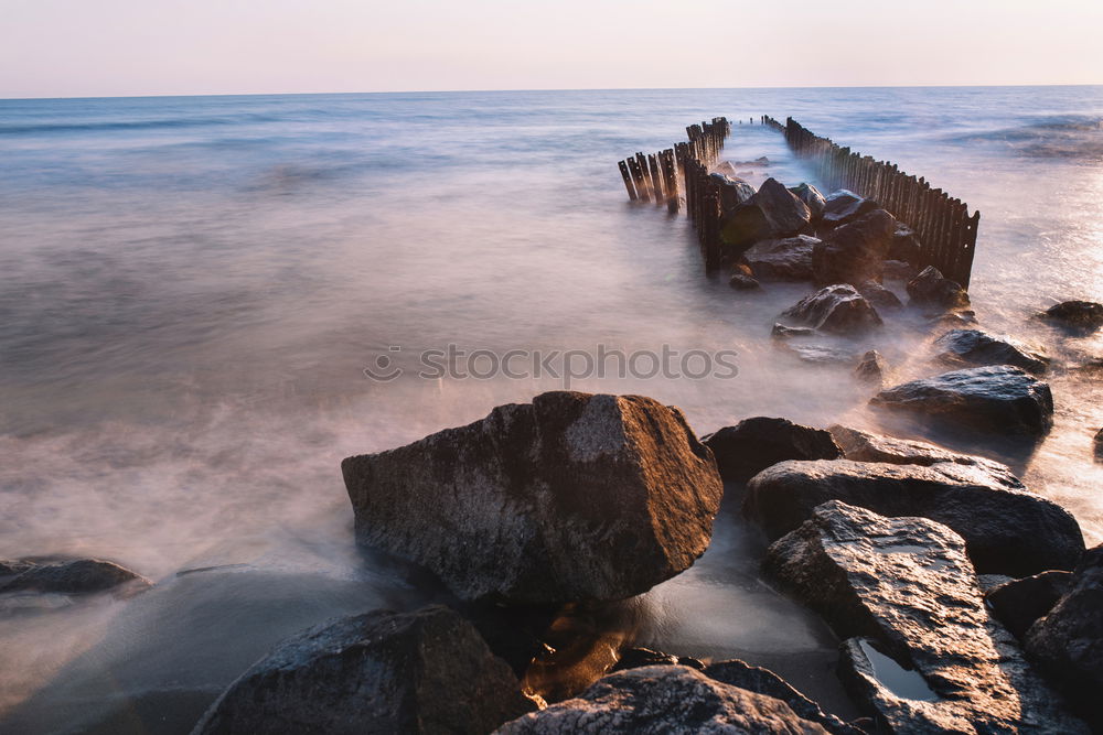 Similar – Rocky coast in the morning light