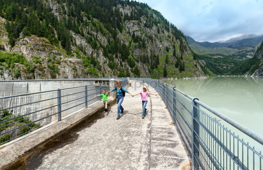 Similar – Women at lake in mountains