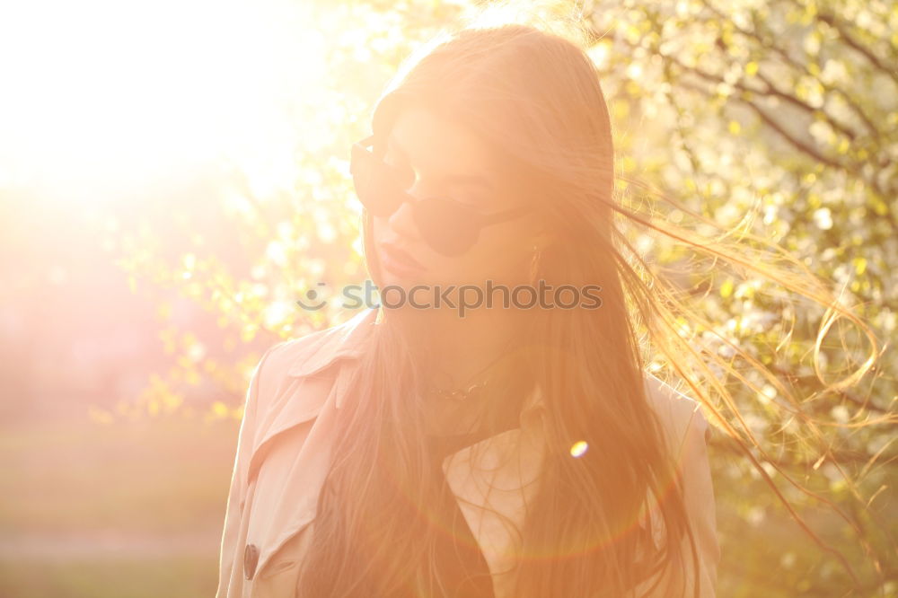 Similar – Image, Stock Photo Thoughtful young woman with bowed head on yellow meadow. Attractive girl with bowed head on a meadow of flowers in yellow to the horizon in the sunshine in spring or summer. Photo of a series.