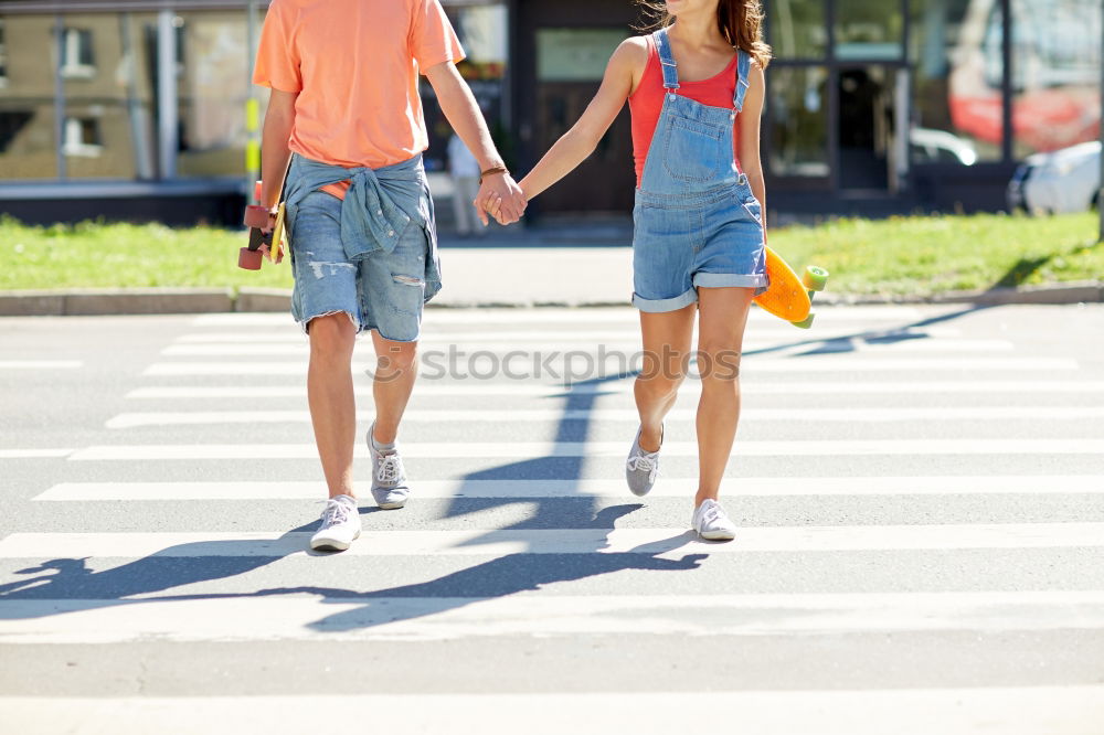 Similar – Image, Stock Photo Young couple walking through the city