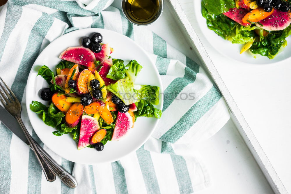 Similar – Mixed salad with baby leaves, radish, cucumber and feta cheese