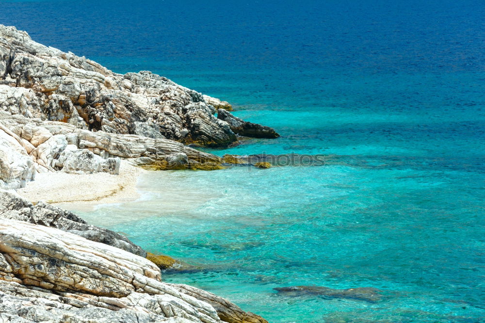 Similar – Image, Stock Photo Peninsula with rocks and beach in turquoise blue sea from above