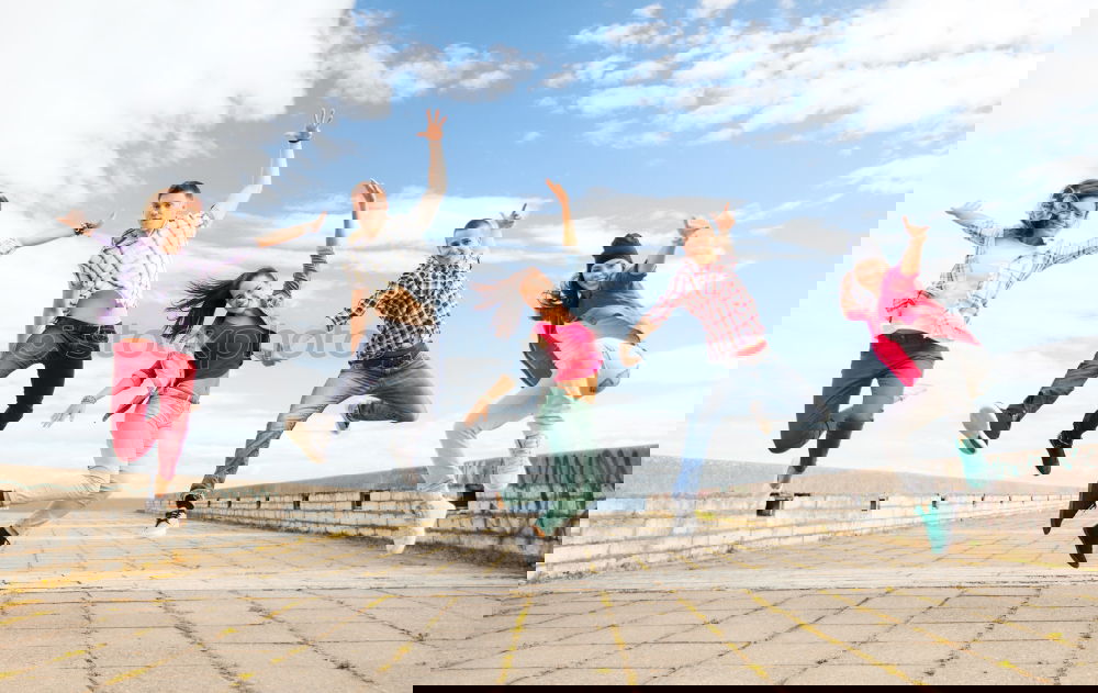Similar – Image, Stock Photo Multi-ethnic group of young people having fun together outdoors in urban background.
