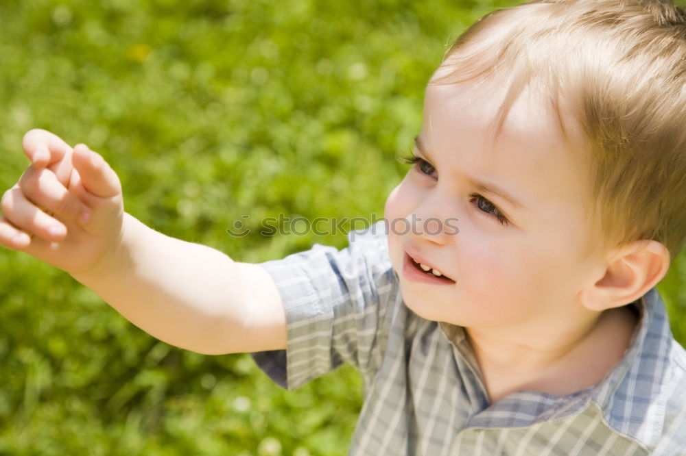 Similar – Child collects chestnuts