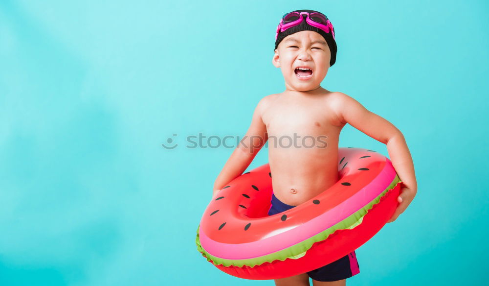 Similar – Happy child with sunglasses eats watermelon