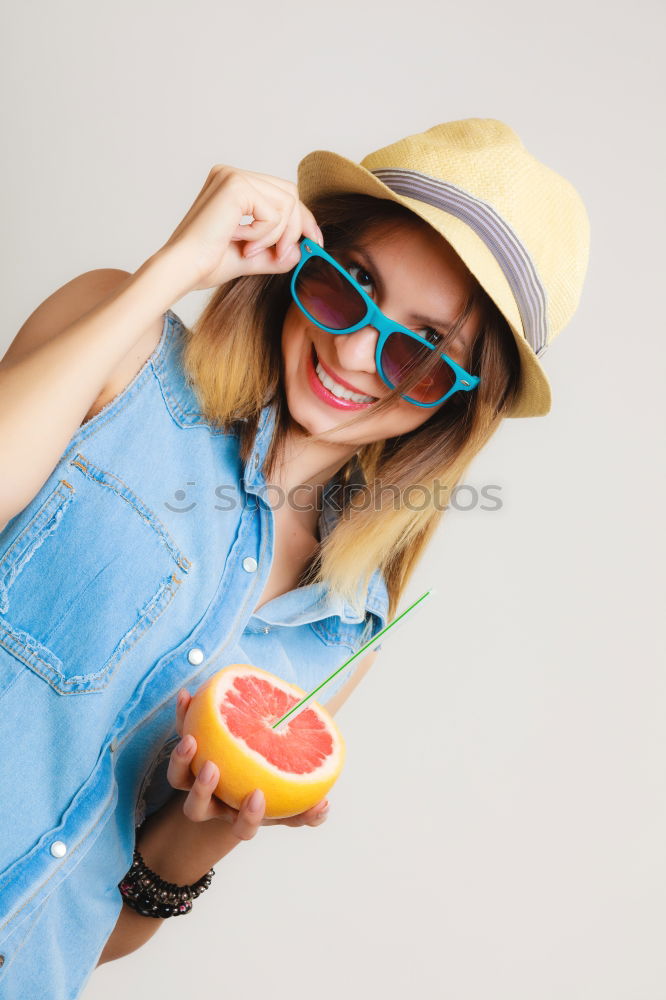 Similar – happy boy drinking orange juice on blue background