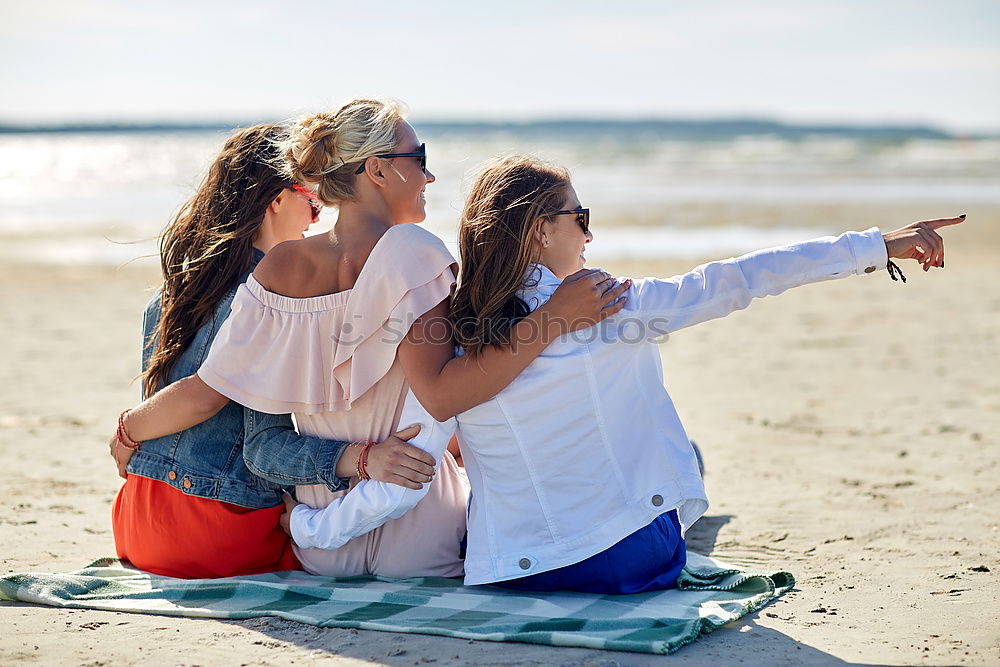 Similar – Happy best friends having good time on the beach together