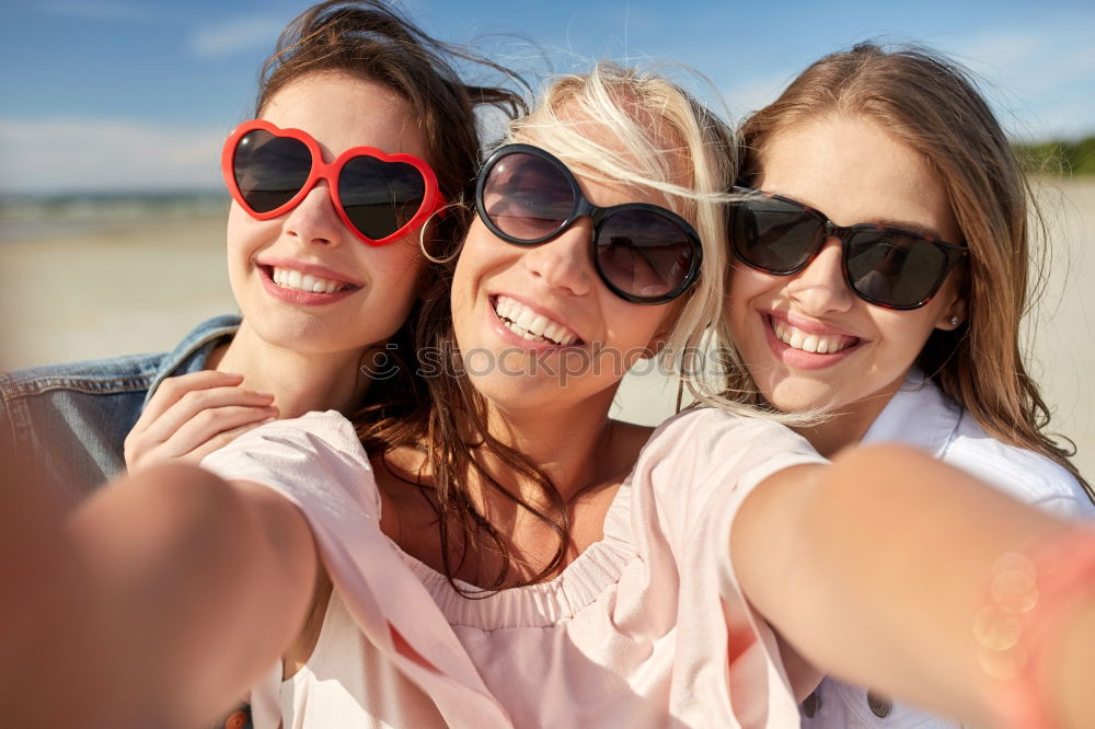 Similar – Beautiful women taking a selfie portrait in the park.