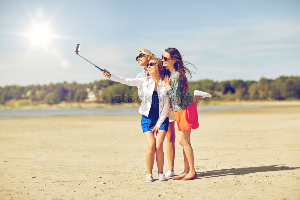 Similar – Women posing in sandy hills