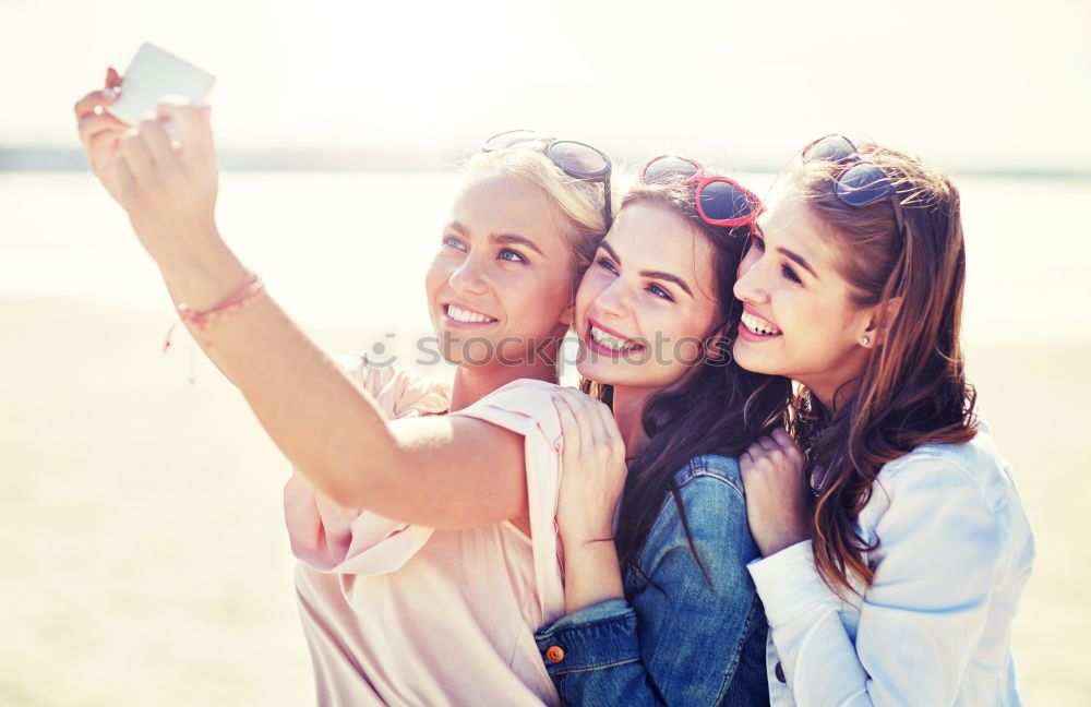 Similar – Beautiful women taking a selfie portrait in the park.